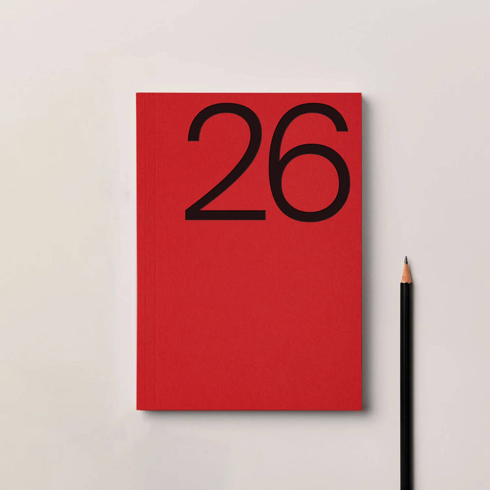 Red notebook with the number 26 on a light gray background. 2026 Diary Red | Kinshipped |Shop Fodder