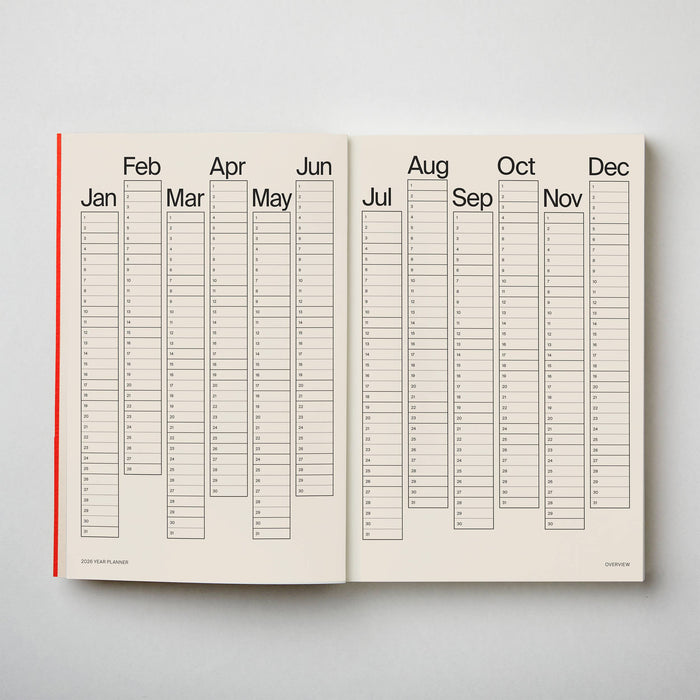 Open planner showing a yearly calendar layout on a light grey background. 2026 Diary Red | Kinshipped |Shop Fodder