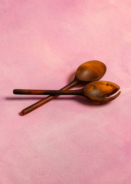 Two wooden spoons on a pink background. Maegen | Shop Fodder