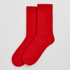 Red merino socks on a light gray background. Pairs Socks | Shop Fodder