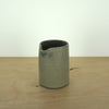perfect straight blue milk jug handmade by Aku ceramics on a wooden table. 