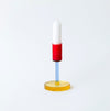 coloured glass candlestick holder on white background. 