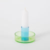 green and blue candlestick holder on white background. 