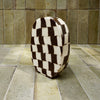 Black and white checkered vase on a tiled bench | Fern Taylor Ceramic Nerikomi Vase | Shop Fodder