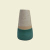 A conical ceramic vase with a fluted design, featuring a beige and green color scheme. Fluted Ceramic Vase | Jode Pankhurst | Shop Fodder