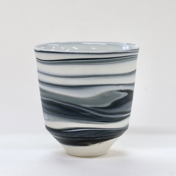 Ceramic tumbler with black and white marbled pattern on a white background  | Janne Meijer | Shop Fodder
