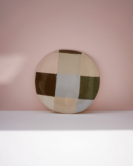 Round ceramic plate with a geometric pattern on a pink background. Patchwork Platter | Brutes London | Handmade Ceramics | Fodder

