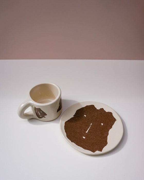 Ceramic mug and coaster with brown abstract design on a white surface. Portrait Mug | Brutes London | Handmade Ceramics | Fodder