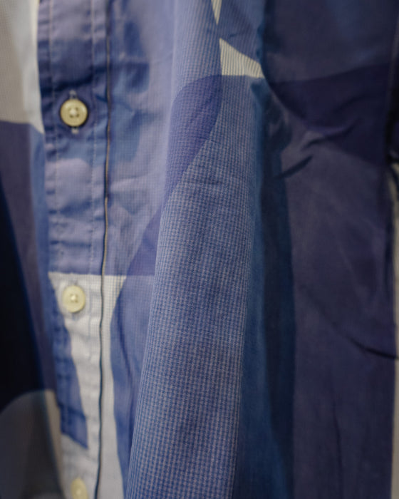 Close-up of a blue and white patterned button-up shirt, showing the fabric texture, buttons, and folds. Caroline Dickinson Shirt | Fodder