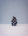 Checkered vase on a white surface with a light gray background. Nerikomi Vase | Fern Taylor | Shop Fodder