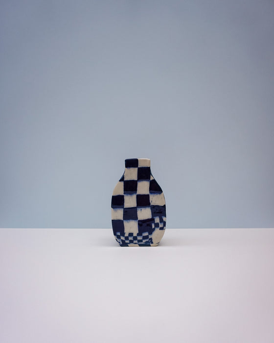Checkered vase on a white surface with a light gray background. Nerikomi Vase | Fern Taylor | Shop Fodder