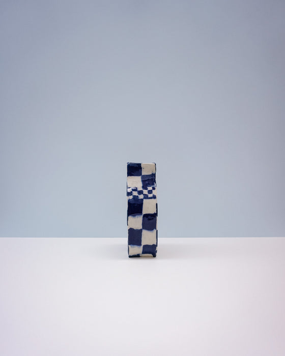 Checkered box with blue and white pattern on a light gray background. Nerikomi Vase | Fern Taylor | Shop Fodder