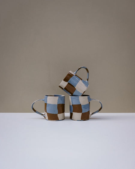 Handbuilt nerikomi check coffee mug by Fern Taylor in layered coloured stoneware. Fodder