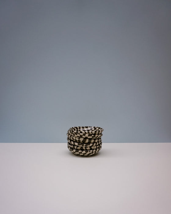 Small woven basket with black and white pattern on a gray background. Fern Taylor | Nerikomi Dish | Shop Fodder