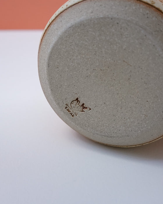 Close-up of a ceramic plate with a textured surface on a white background. Liz Vidal Ceramics | Shop Fodder