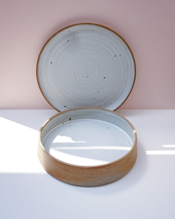 Large deep ceramic serving dish shown with the large serving plate in speckled white on buff stoneware | Scree Ceramics | Fodder 