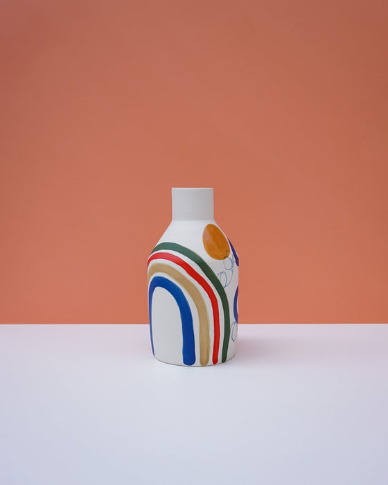 Vase with colorful design on a peach background. Sophie Alda | Handmade Ceramics | Shop Fodder