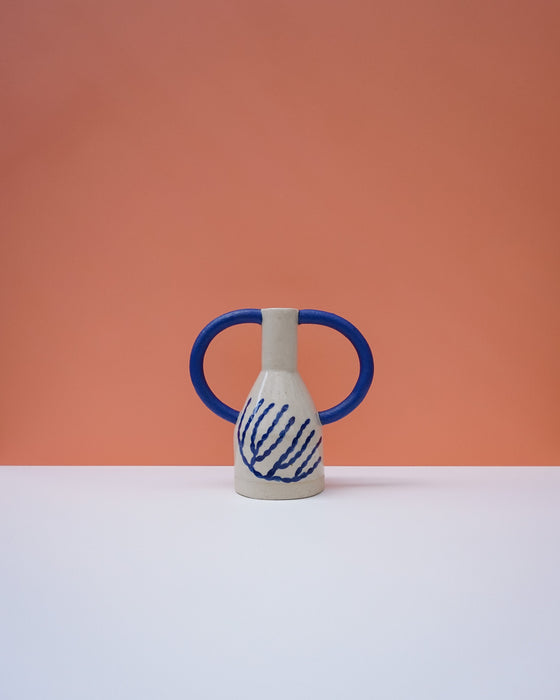 Ceramic vase with blue handles and abstract design on a peach background. Sophie Alda | Handmade Ceramics | Shop Fodder