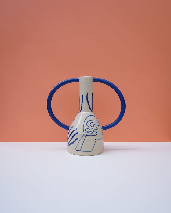 Ceramic vase with blue handles and abstract design on a peach background. Sophie Alda | Handmade Ceramics | Shop Fodder
