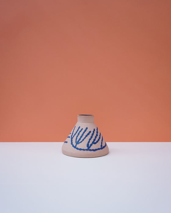 Ceramic vase with blue patterns on a peach and white background. Sophie Alda | Handmade Ceramics | Shop Fodder