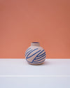 Vase with blue patterns on a peach and white background. Sophie Alda | Handmade Ceramics | Shop Fodder