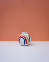 Round vase with colorful design on a peach background. Sophie Alda | Handmade Ceramics | Shop Fodder