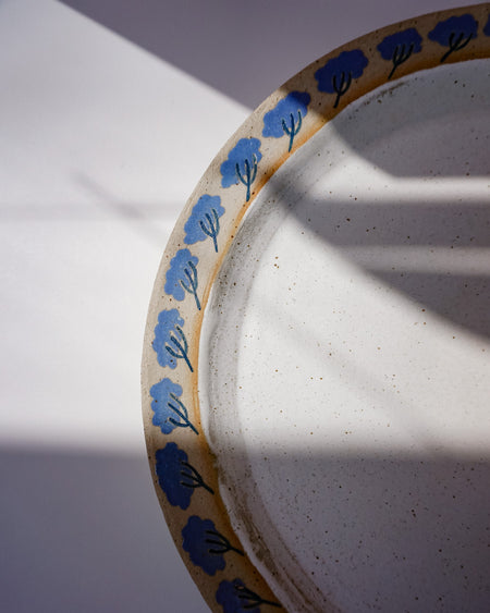 Ceramic plate with blue floral patterns on a white background. Sophie Alda | Handmade Ceramics | Shop Fodder