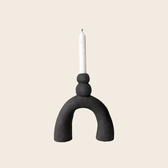 Small handmade sculptural black candlestick holder by HoodMor Ceramics in a black textured clay. 