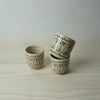 Small Crowd Tumbler handmade ceramics by HoodMor Studio. In a stack three tumblers. 