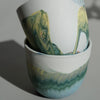 close up detail of handmade marbled porcelain cups. 