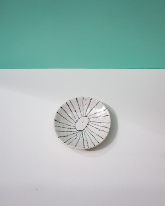 Ceramic plate with black line design on a two-tone background. Diddy Bowl | Jode Pankhurst | Shop Fodder