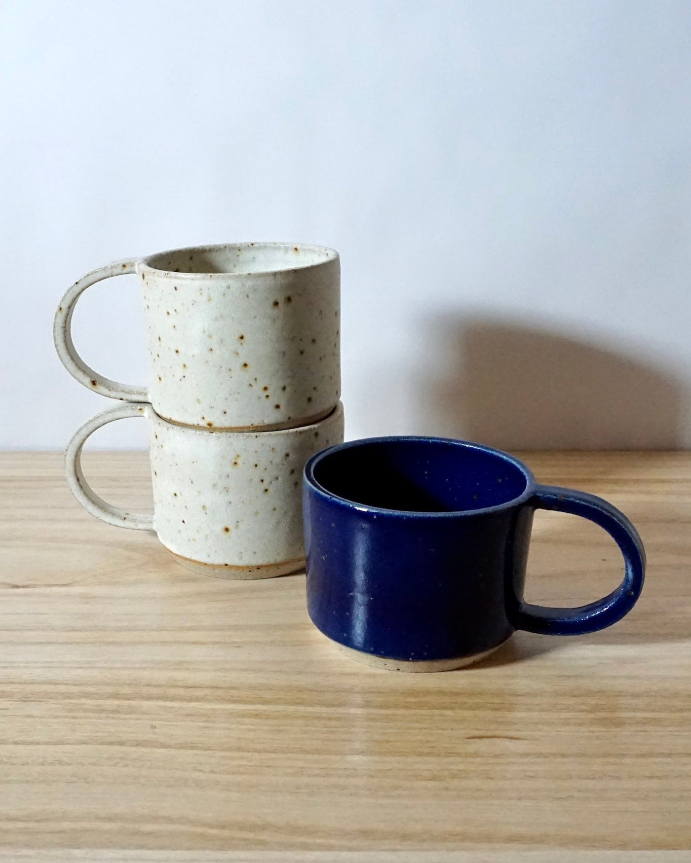 mae ceramics hand thrown Dee Cups in chalk and cobalt. 