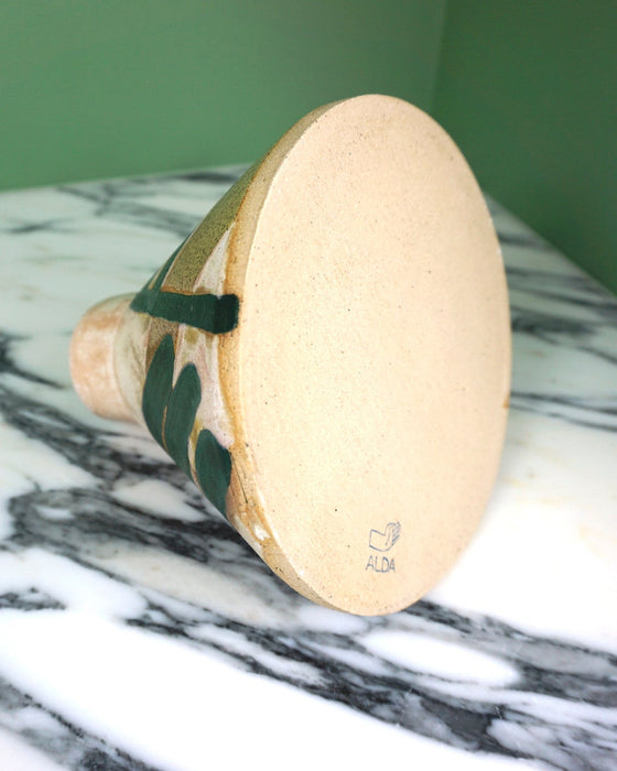 the bottom of a handmade ceramic vase showing the maker mark of Sophie Alda. 