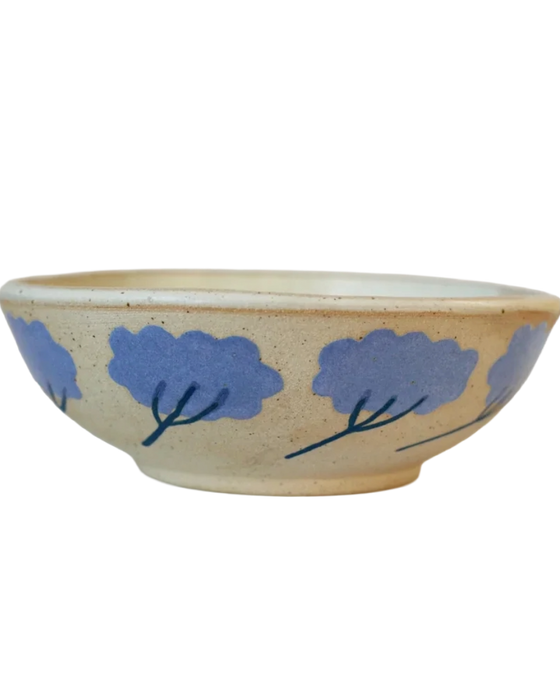 Ceramic bowl with blue floral designs on a beige background. Sophie Alda Yarrow Bowl | Shop Fodder