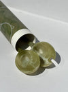 Two green marbled objects with a cylindrical container on a white background. Maegen | Shop Fodder