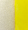 close up detail of sand clay and a bright yellow glaze. 