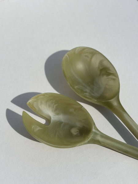 Two green ceramic spoons on a white background. Maegen | Shop Fodder